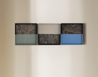 May include: Three rectangular trays with black frames. The top half of each tray is a brown and black marbled pattern. The bottom half of each tray is a solid color: green, beige, and blue.
