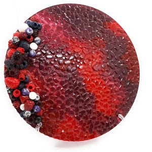 May include: A round, red and purple resin tray with a textured surface. The tray is decorated with a border of fresh berries, including raspberries, blueberries, and strawberries.