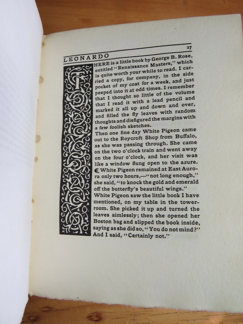 May include: A black and white image of a book with the title "Renaissance Masters" by George B. Rose. The book is open and the text is visible on the pages. The image is surrounded by a decorative border.