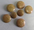 7 Matching Large Celluloid Gold Glitter Buttons    UQ38