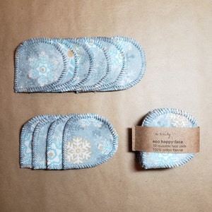 Handmade reusable cotton flannel face pads with natural colour backing - snowflakes - 10 pack