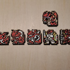 May include: A collection of pixelated wooden figures in various poses, primarily red and white, resembling characters from a video game. The figures are arranged on a light-colored wooden surface.