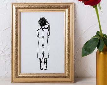 May include: A framed art print with a gold-colored ornate frame. The print features a black and white sketch of a person holding an object. A red rose in a gold vase is to the right of the frame.