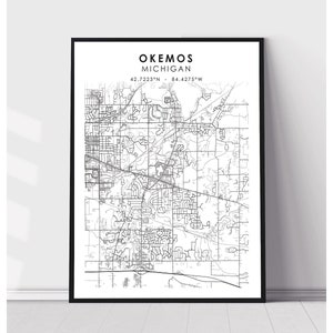 May include: Black and white line art map of Okemos, Michigan. The map shows the city's streets and roads. The text "Okemos, Michigan" and the coordinates "42.7223°N - 84.4275°W" are printed at the top of the map.