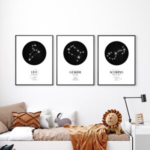 May include: Three black and white framed prints of zodiac constellations. The constellations are Leo, Gemini, and Scorpio. Each print has a black circle with white stars and the name of the constellation below the circle.