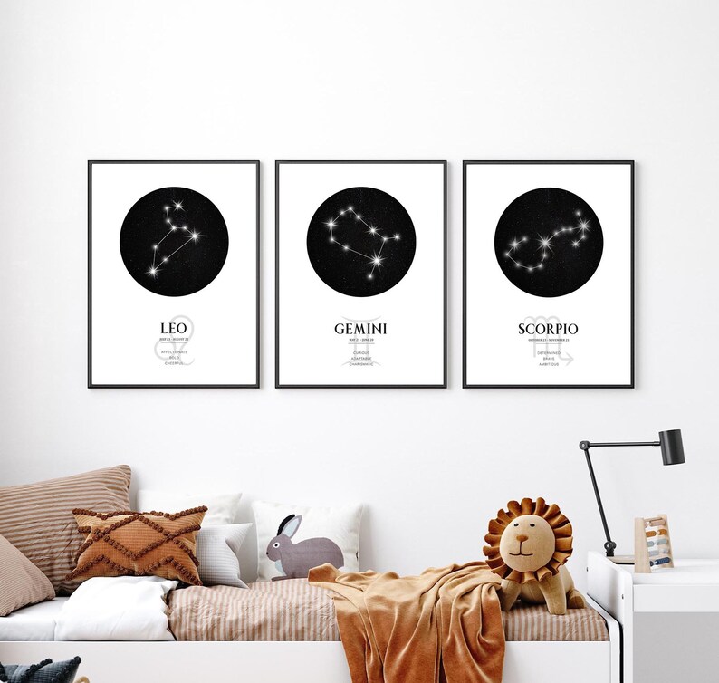 May include: Three black and white framed prints of zodiac constellations. The constellations are Leo, Gemini, and Scorpio. Each print has a black circle with white stars and the name of the constellation below the circle.