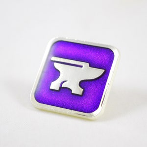 May include: A purple enamel pin with a silver anvil design.