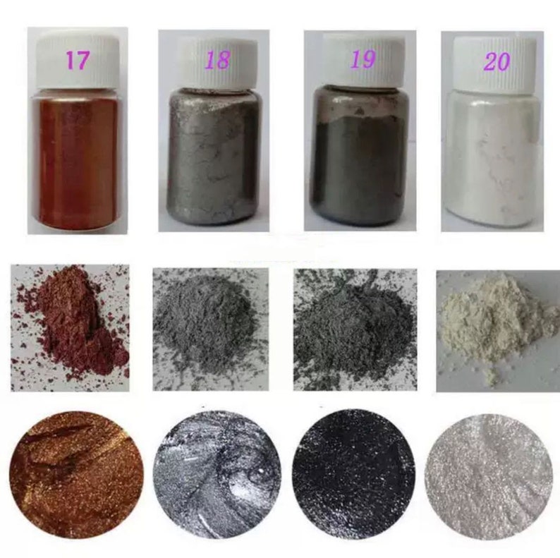 May include: Four small bottles of metallic pigment powder, labeled 17, 18, 19, and 20. The bottles contain red, silver, gray, and white powder. The powder is shown in a pile below each bottle.