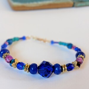 Royal Blue and Jewel-Toned Beaded Bracelet with Turquoise and Gold highlights