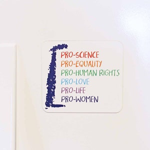 May include: A white square with a blue outline and the text "PRO-SCIENCE", "PRO-EQUALITY", "PRO-HUMAN RIGHTS", "PRO-LOVE", "PRO-LIFE", and "PRO-WOMEN" written in different colors.