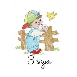 May include: Embroidered design of a boy in overalls standing by a wooden fence with a yellow bird flying above him. The text "3 sizes" is below the image.