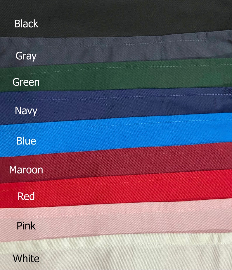 May include: A close-up of fabric swatches in various colors, including black, gray, green, navy, blue, maroon, red, pink, and white. The swatches are arranged in a vertical stack, with the darkest color at the top and the lightest color at the bottom.