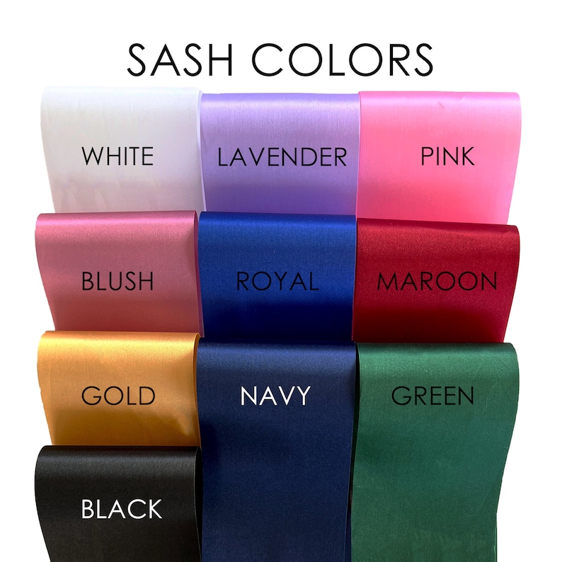 May include: A collection of 10 different colored satin sashes with the color names written below each sash. The colors are white, lavender, pink, blush, royal blue, maroon, gold, navy, green, and black.