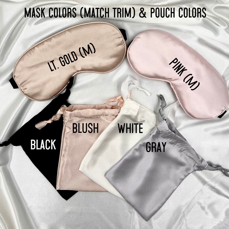 May include: A set of six silk sleep masks and matching pouches in various colors, including black, blush, white, gray, light gold, and pink. The sleep masks have the text "LT. GOLD (M)" and "PINK (M)" printed on them.