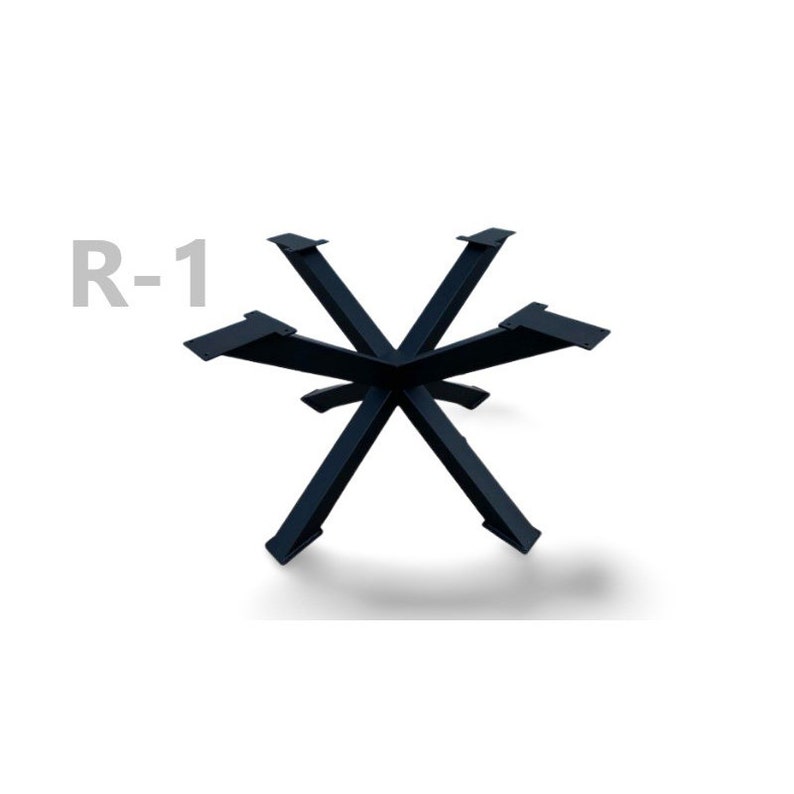 May include: Black metal table base with a starburst design. The base is labeled "R-1".