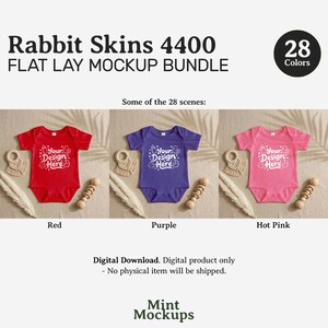 May include: A flat lay mockup bundle featuring three baby onesies in red, purple, and hot pink. Each onesie has the text "Your Design Here" printed on the front. The image includes a wooden rattle and a beige teething ring.
