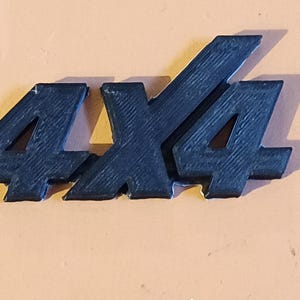 May include: Black plastic 4x4 emblem.