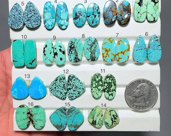May include: A collection of sixteen pairs of turquoise gemstones in various shapes and patterns. The gemstones range in color from light to dark blue and green, with brown and black matrix patterns. A US quarter is included for size reference.