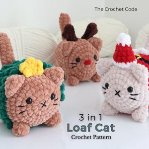 May include: Three crocheted plush cats, one wearing a green tree costume with a yellow star, one with brown reindeer antlers, and one in a red and white Santa outfit. The text reads The Crochet Code and 3 in 1 Loaf Cat Crochet Pattern.