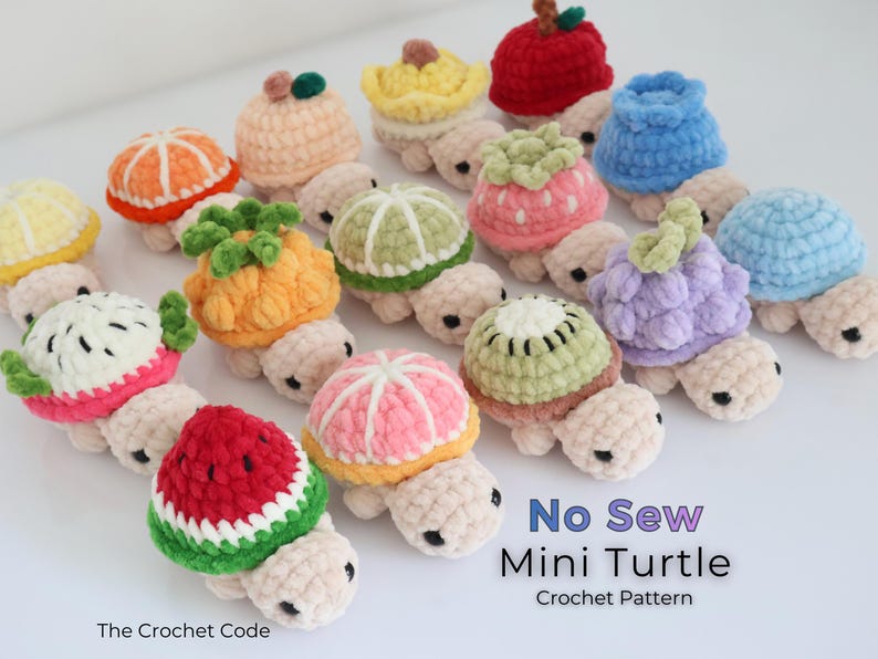 May include: A collection of crocheted mini turtles, each adorned with a different fruit design. The turtles feature various colors, including orange, red, green, and pink, and are arranged on a white surface. The text "No Sew Mini Turtle Crochet Pattern" is visible.