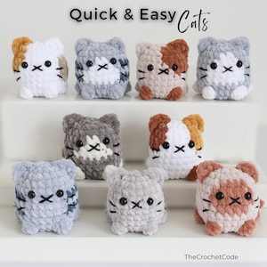 May include: A collection of handmade crochet cat figurines in various colors, including white, gray, brown, and tan. Each cat has a unique pattern and embroidered facial features. The text "Quick & Easy Cats" is displayed at the top.
