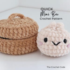 May include: A tan crocheted lidded container and a light pink crocheted bao bun with black eyes, a black stitched mouth, and pink cheeks. The text reads QUICK Mini Bao Crochet Pattern and The Crochet Code.