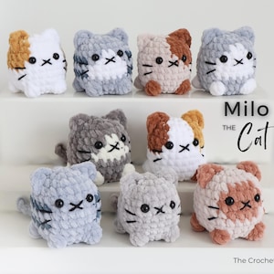 May include: A collection of handmade crochet cat figurines in various colors, including white, gray, and brown. Each cat has black eyes and whiskers. The text "Milo the Cat" and "The Crochet Code" are also visible.