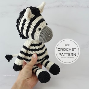 May include: Crochet pattern for a black and white striped zebra amigurumi toy. The PDF pattern is written in UK terms.