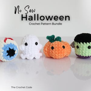 May include: Four handmade crochet Halloween figures: an eyeball, a ghost, a pumpkin, and a Frankenstein's monster. The text "No Sew Halloween Crochet Pattern Bundle" is at the top. The figures are displayed on a reflective surface.