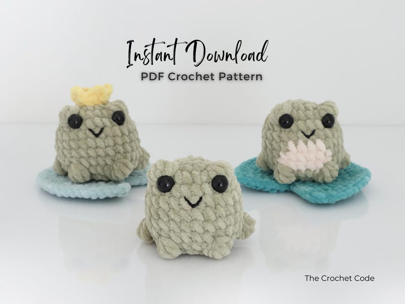 May include: Three handmade crochet frog toys in shades of green, each with black button eyes and a stitched smile. One frog wears a yellow crown. They sit on blue lily pads. The text "Instant Download PDF Crochet Pattern" is above them.