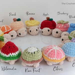 May include: A collection of crocheted turtle toys, each designed to resemble a different fruit. The turtles are in various colors, including red, yellow, green, and pink. The text "The Crochet Code" is visible.