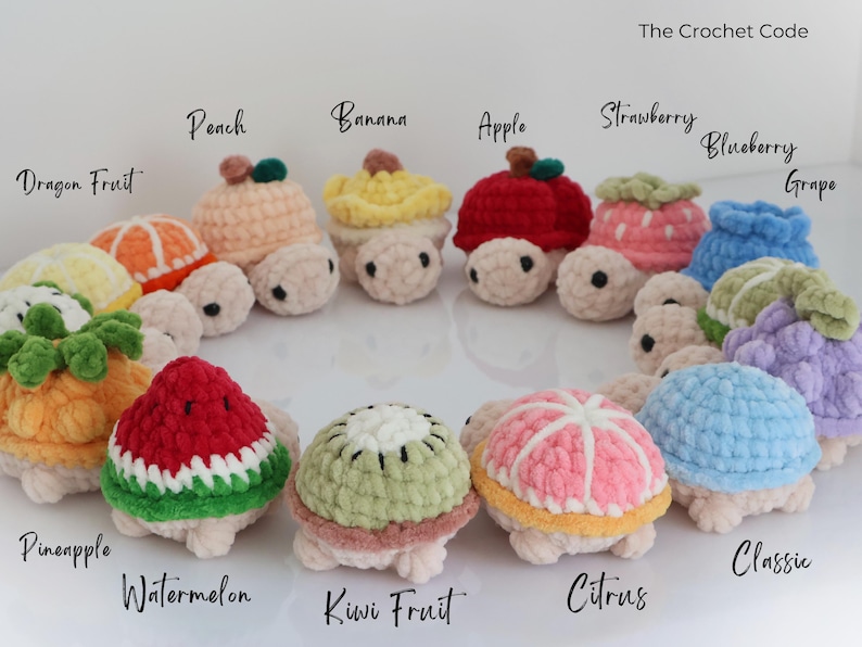 May include: A collection of crocheted turtle toys, each designed to resemble a different fruit. The turtles are in various colors, including red, yellow, green, and pink. The text "The Crochet Code" is visible.
