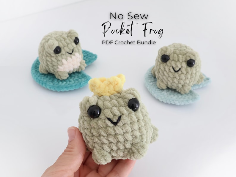 May include: Three handmade crochet frogs in shades of green, sitting on blue lily pads. One frog has a yellow crown. The text "No Sew Pocket Frog PDF Crochet Bundle" is at the top. The frogs have black eyes and smiling faces.