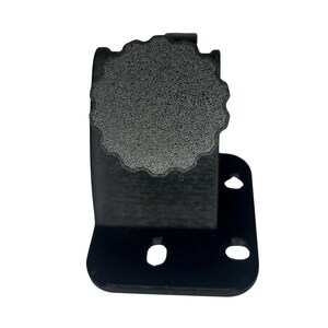May include: A black metal bracket with a textured, circular knob. The bracket has a right-angle shape with three circular holes. The knob is gray and has a ridged edge.