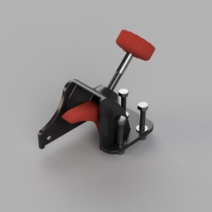 May include: A black and red mechanical lever with a red handle. The lever is mounted on a black base with silver bolts. The design is industrial and functional, with a focus on the lever's operation.