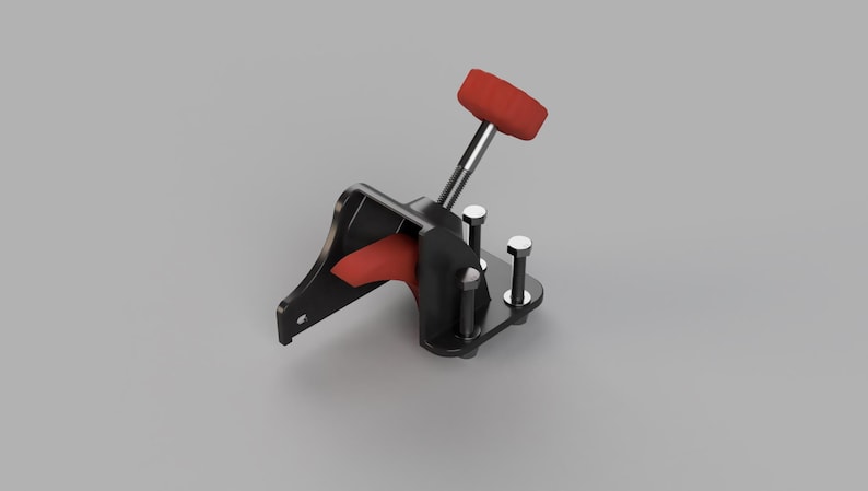 May include: A black and red mechanical lever with a red handle. The lever is mounted on a black base with silver bolts. The design is industrial and functional, with a focus on the lever's operation.