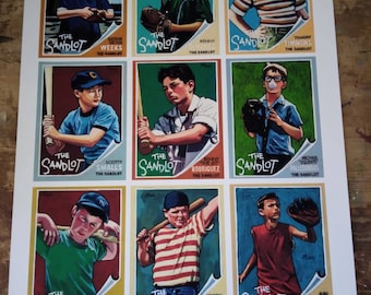 May include: A set of nine baseball cards featuring characters from the movie The Sandlot. Each card has a colorful illustration of a different character, their name, and their role in the movie. The cards are numbered 012/250.