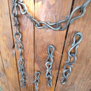 Chain holder, hand forged chain, wall chain, barn chain, garden equipment, yard decor.