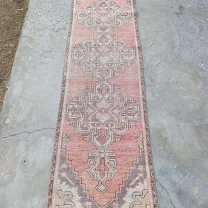 May include: A white ceramic mug with a black handle and the text "But First, Coffee" in a black, bold font. The mug is likely for hot beverages and has a glossy finish.