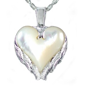 May include: A heart-shaped pendant with a pearlescent center and silver-colored wing accents. The pendant hangs from a silver chain. The heart-shaped pendant is a romantic jewelry item.