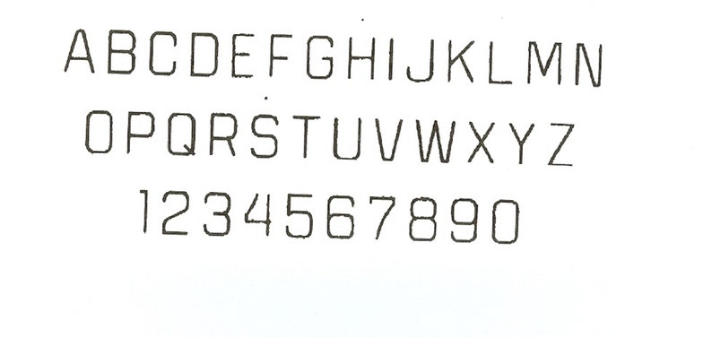May include: A black and white image of the alphabet in uppercase letters, followed by the numbers 1 through 9 and 0.