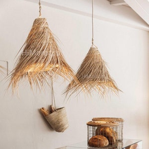 Braided suspension in natural palm fibre - handcrafted straw lampshades for warm, natural lighting.
