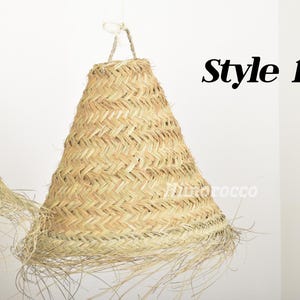 May include: A natural woven lampshade with a fringe, in a cone shape. The lampshade is made of natural materials and has a light brown color. The text "Style 1" is visible in the image.