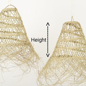 May include: Two natural woven pendant lights with a fringe detail. The lights are hanging from a white ceiling. The word "Height" is written on the image.