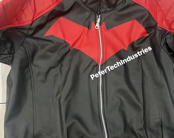 May include: Black faux leather jacket with a red hooded liner and a red bat symbol on the front. The zipper has a silver finish. The text "PeterTechIndustries" is visible on the front of the jacket.
