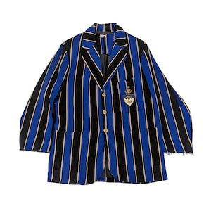 May include: A blue, black, and gold striped blazer with a crest on the chest. The blazer has gold buttons and a classic tailored design. The jacket is a vintage style.