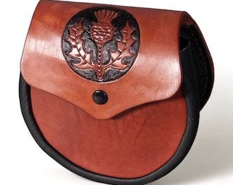 Handmade scottish sporran of leather, with thistle