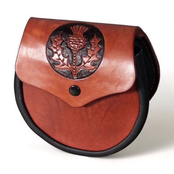 Handmade scottish sporran of leather, with thistle