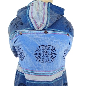 May include: A blue hooded shirt with a striped pattern and black geometric designs. The shirt has a relaxed fit and is made of a soft, comfortable fabric.