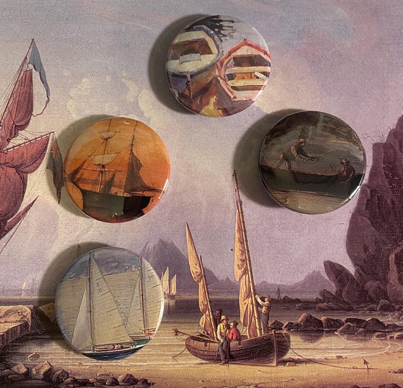 May include: Four round buttons featuring images of sailing ships. The buttons are displayed against a backdrop of a painting depicting a seascape with a sailboat in the foreground.